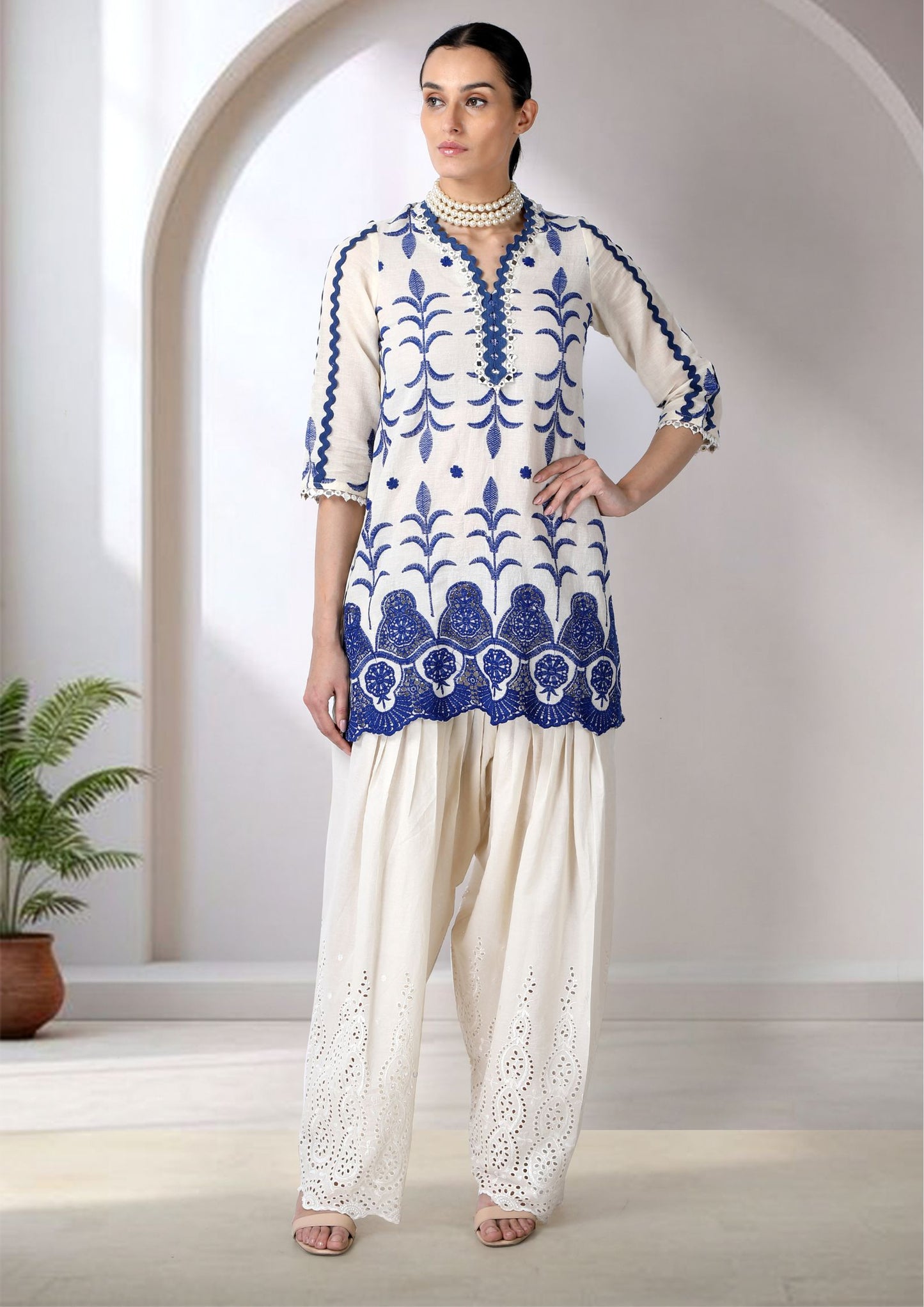 White And Blue Embroidered Cotton Mul Kurta Set.