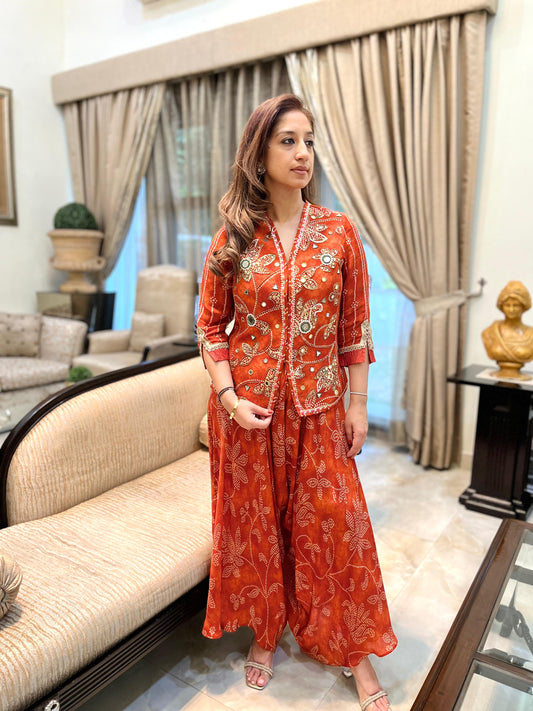 Orange floral bandhini top with stylised drape pants